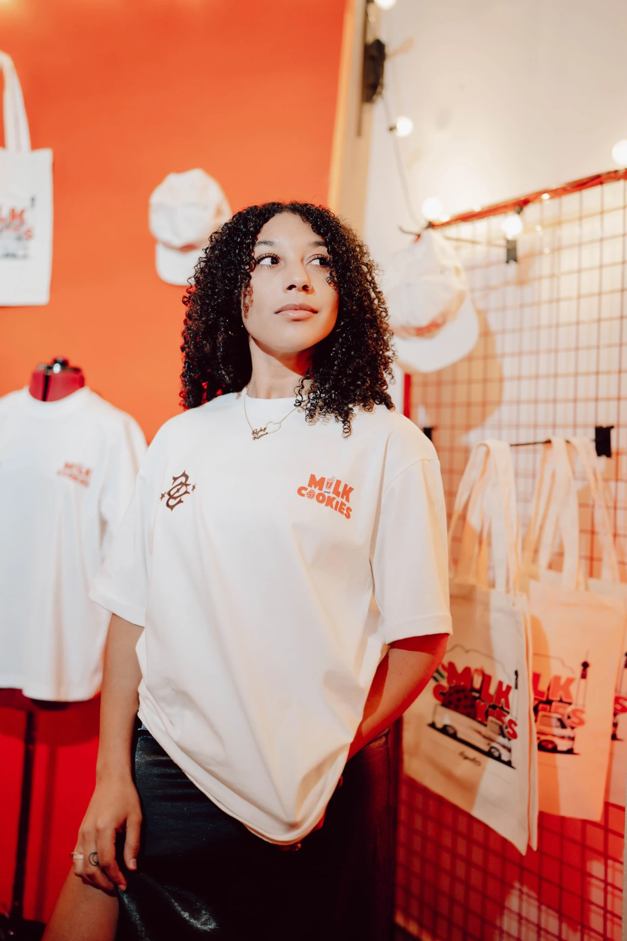 Portrait in a Milk + Cookies shirt at a branded event